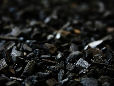 Detailed close-up of charcoal briquettes showing textures and shades.